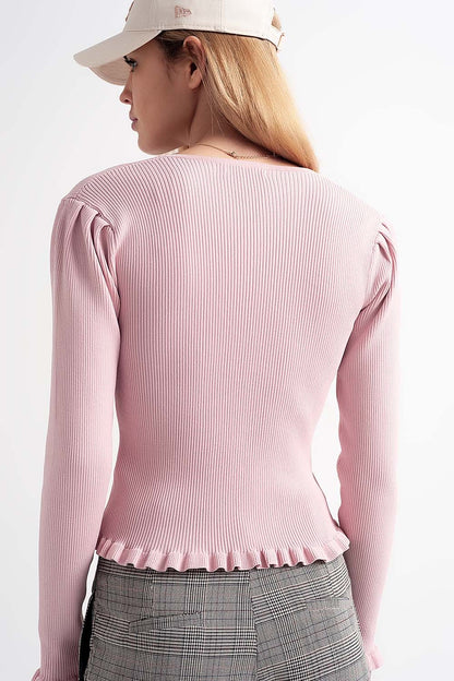 Jersey de canalé en color rosa con detalle de botones de perlas