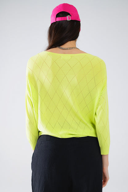 Jersey de color lima con estampado de rombos y cuello barco