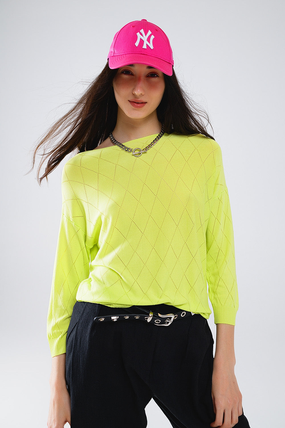Jersey de color lima con estampado de rombos y cuello barco