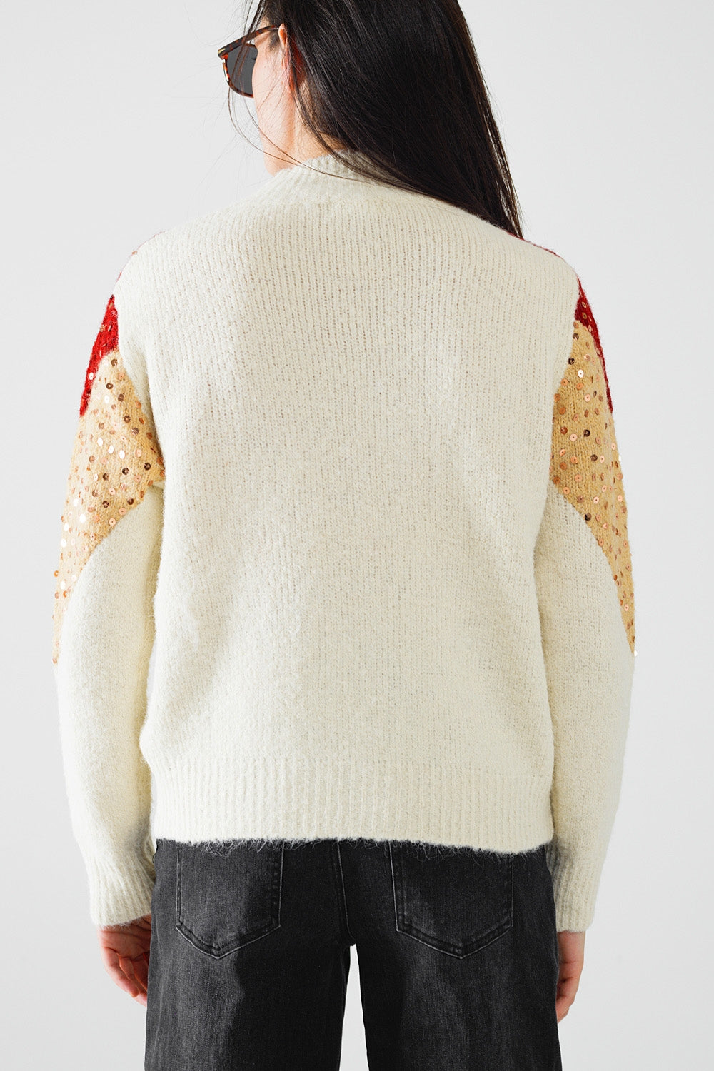 jersey de punto de color burdeos y beige con adorno de lentejuelas