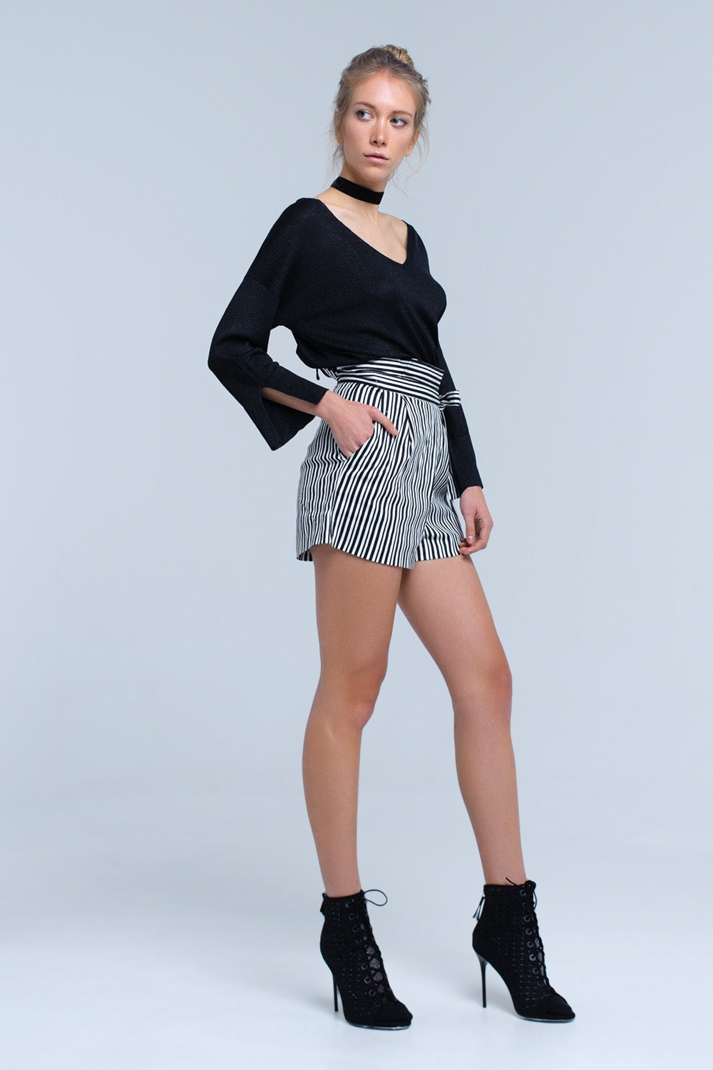 Jersey de punto negro con detalle de lurex dorado