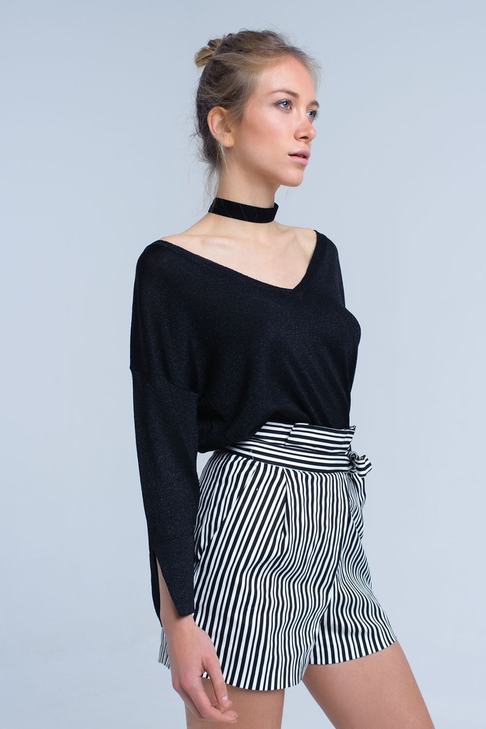 Jersey de punto negro con detalle de lurex dorado
