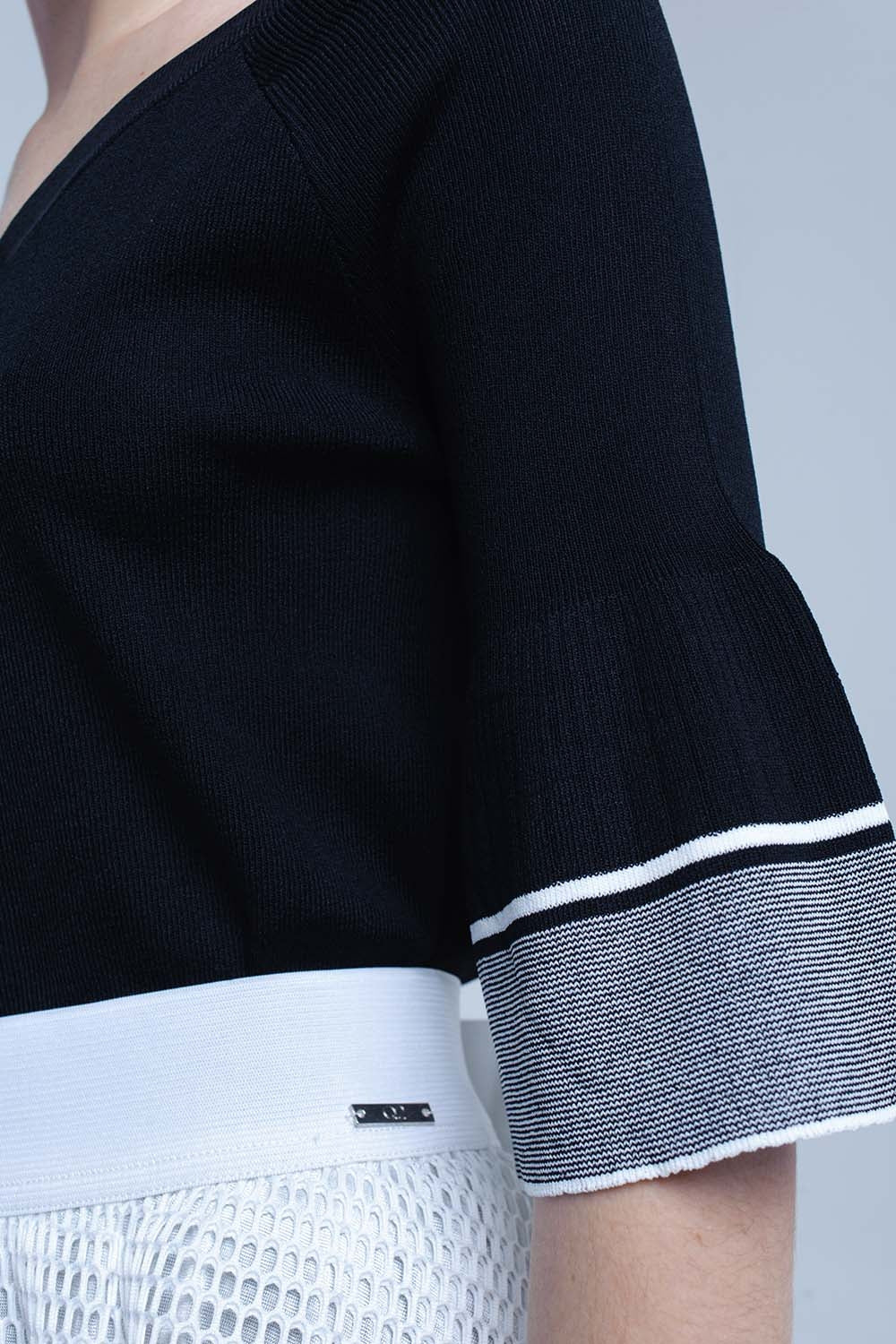 Jersey de punto negro con manga de campana