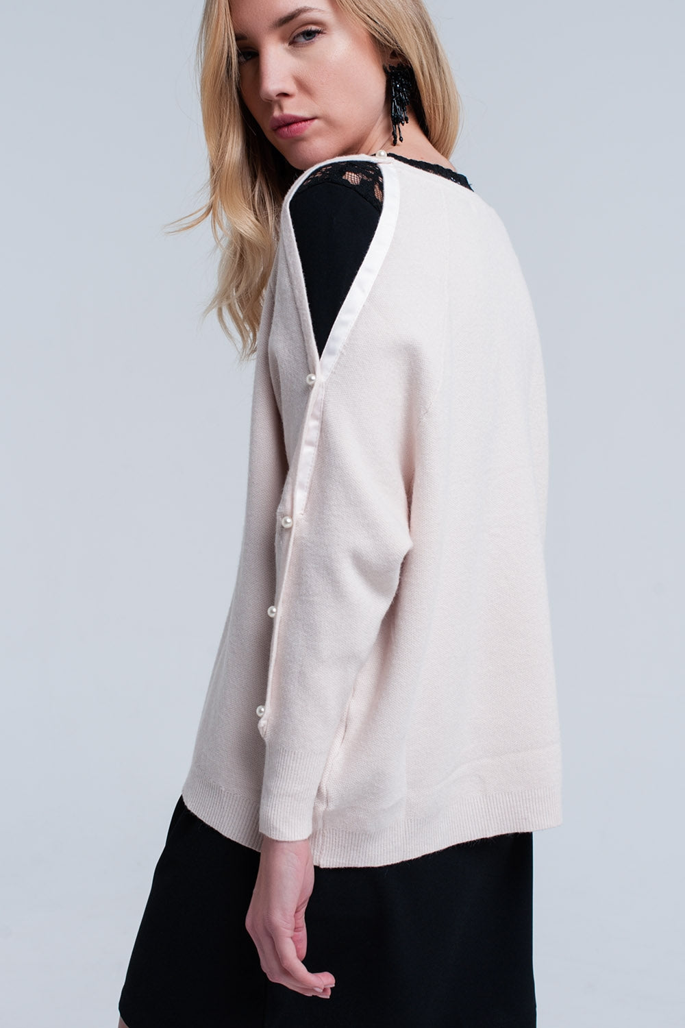 Jersey de punto pálido rosa con detalle de perla