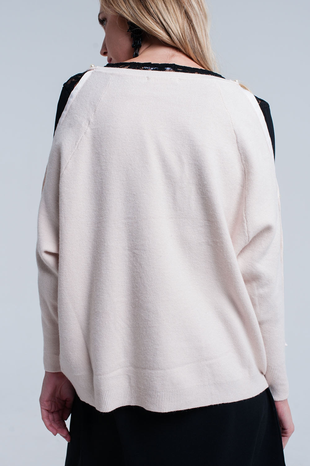 Jersey de punto pálido rosa con detalle de perla