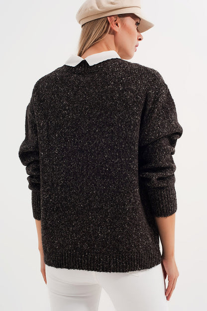 Jersey en color negro jaspeado de cuello redondo