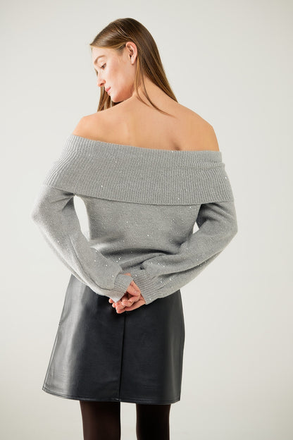 Jersey gris de cuello barco con lentejuelas
