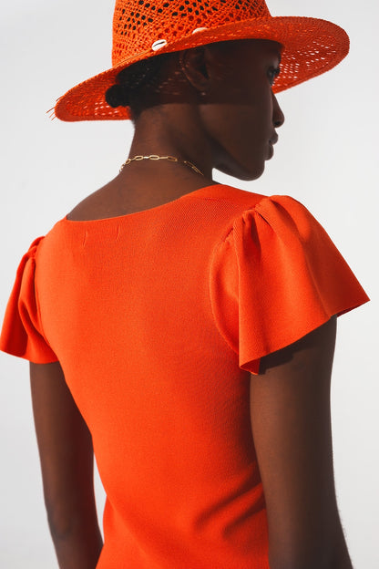Jersey naranja con mangas abullonadas y escote cuadrado