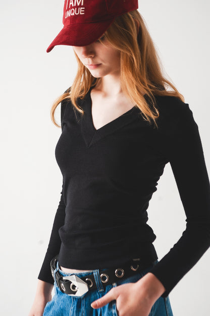 Jersey negro con escote V de punto fino