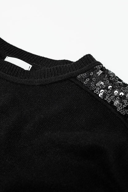 Jersey negro de manga larga con lentejuelas en los hombros