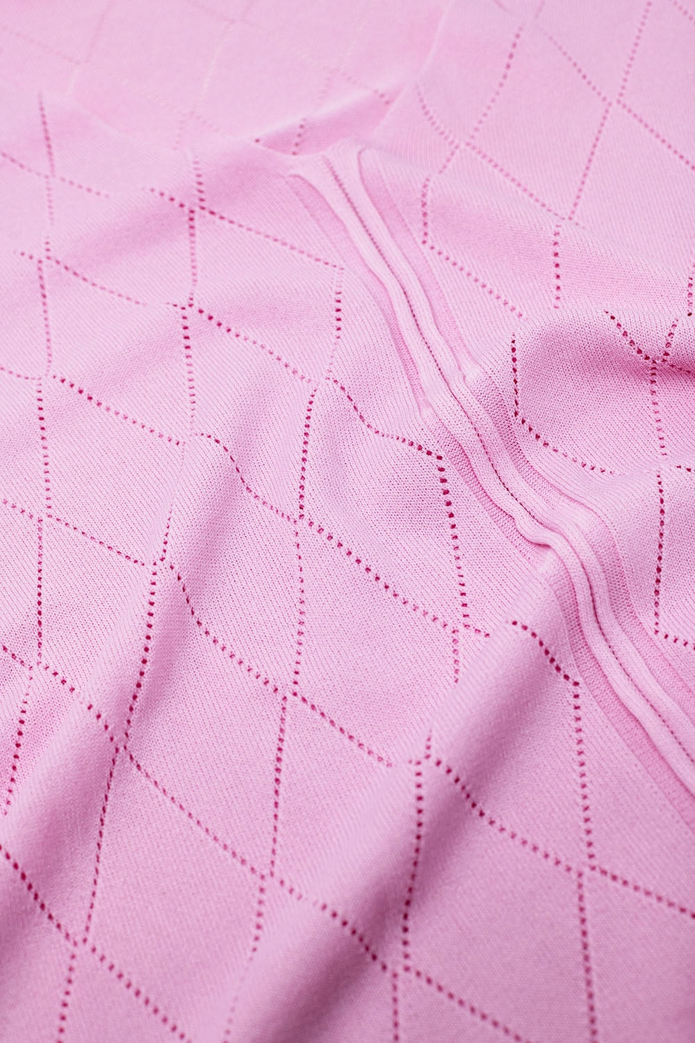 Jersey rosa claro de manga corta con estampado de rombos