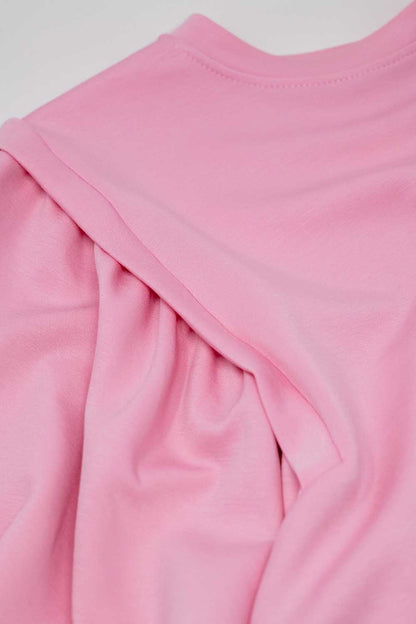 Jersey rosa de manga larga con detalles de costura frontal en los laterales