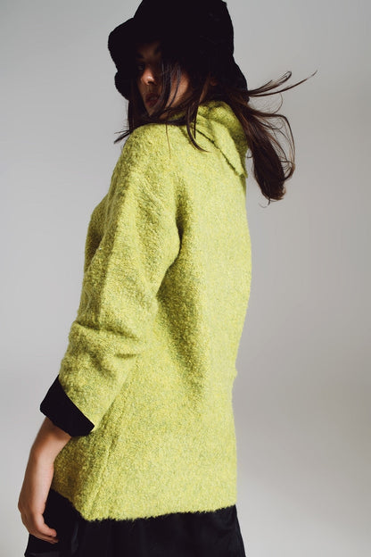 Jersey verde con cuello bardot.