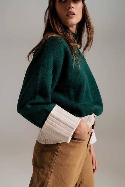 Jersey verde con puños y dobladillo blanco en canalé