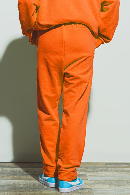 Jogger de gran tamaño con cintura anudada en naranja brillante