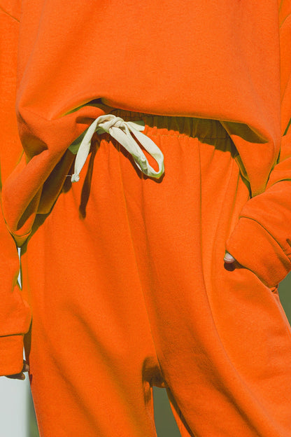 Jogger de gran tamaño con cintura anudada en naranja brillante