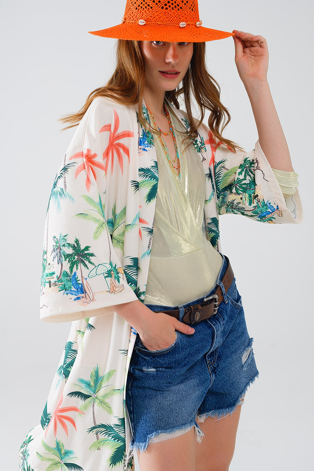 Kimono abierto en color crema con estampado playero y largo midi