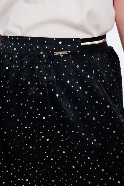 Minifalda negra con pliegues y estampado de lunares