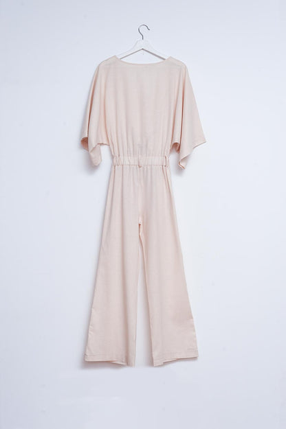 Mono largo de lino beige con lazada en la cintura