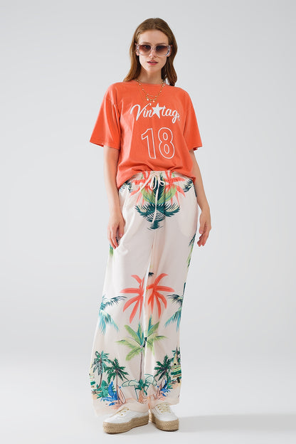 Pantalón recto crema con estampado playero y cintura elástica