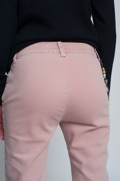 Pantalón utilitario con puños y cadena en rosa