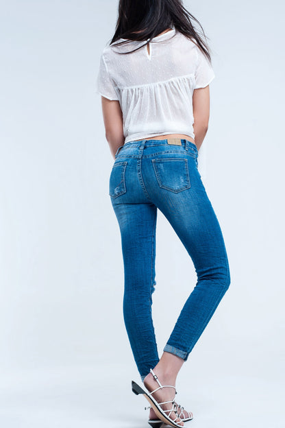 Pantalon vaquero ajustado elastico con rasgaduras