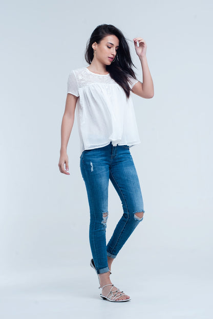 Pantalon vaquero ajustado elastico con rasgaduras