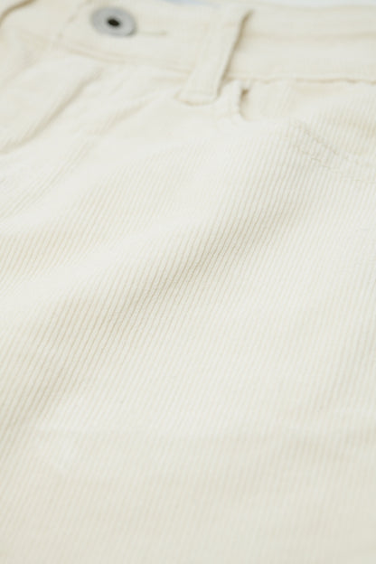 Pantalones acampanados de pana beige claro con estampado de leopardo en el bajo