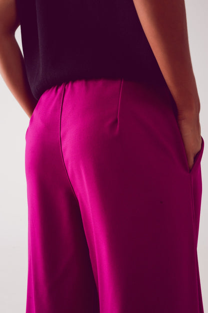 Pantalones anchos plisados de color fucsia