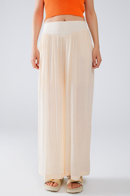Pantalones Beige Estilo Palazzo Con Bolsillos Laterales Y Cintura Gruesa
