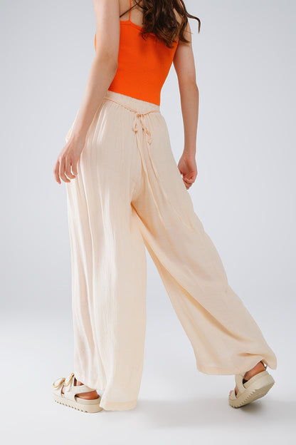Pantalones Beige Estilo Palazzo Con Bolsillos Laterales Y Cintura Gruesa