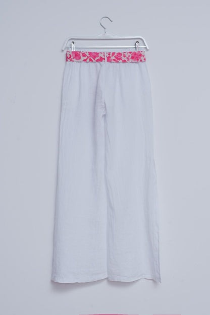 Pantalones de lino blancos de pernera ancha con aberturas laterales