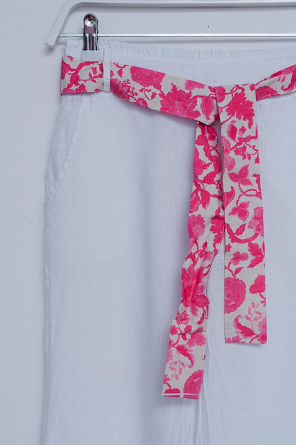Pantalones de lino blancos de pernera ancha con aberturas laterales