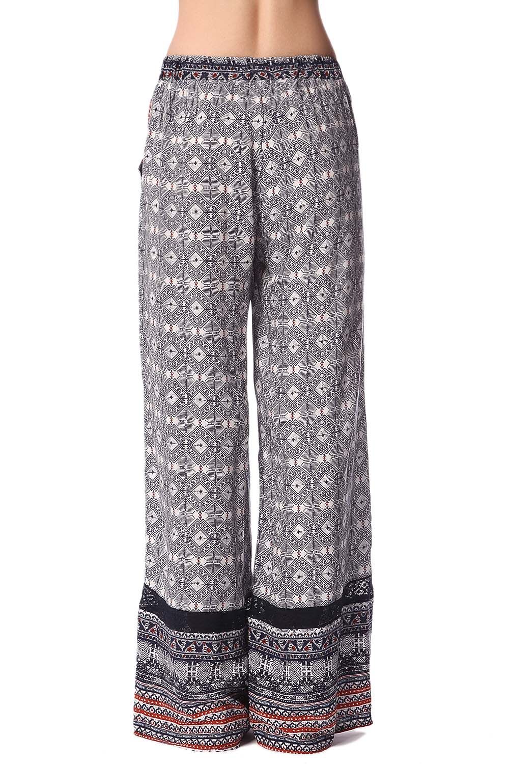 Pantalones de pernera amplia con estampado etnico azul y detalle de puntilla