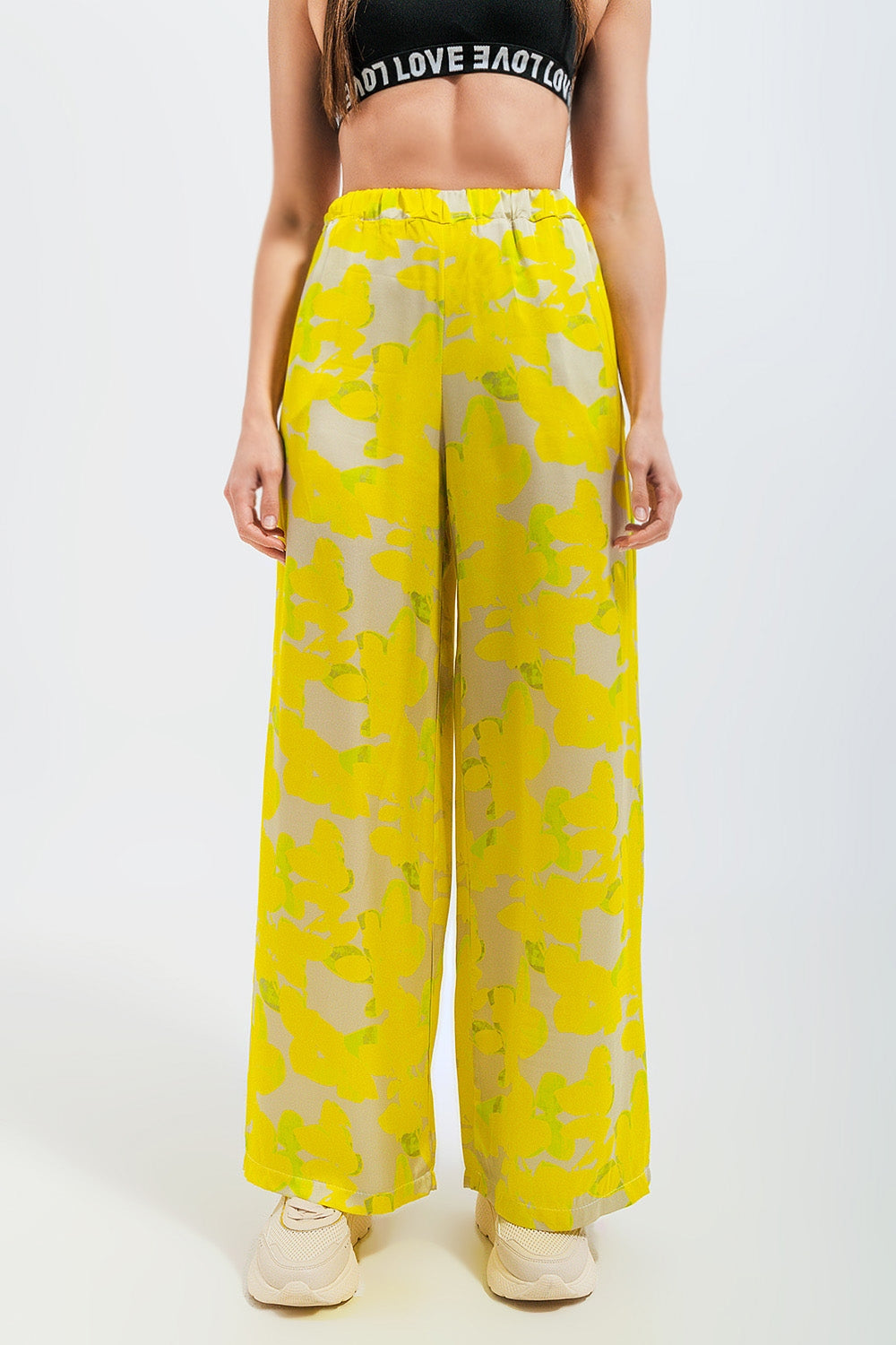 Pantalones de pernera ancha con estampado floral amarillo