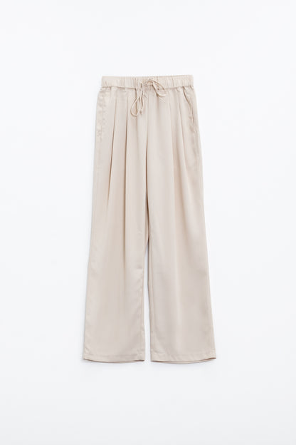 Pantalones En beige Con Bolsillos Delanteros Y Cierre De Cordón