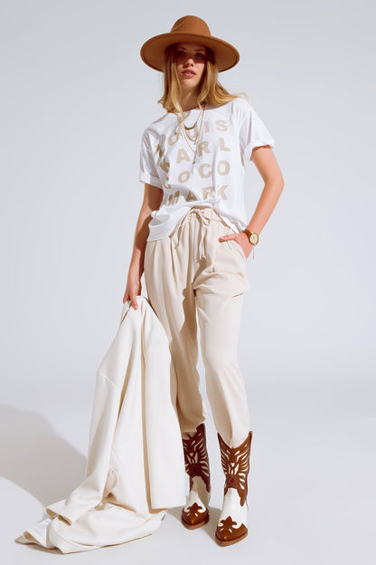 Pantalones En beige Con Bolsillos Delanteros Y Cierre De Cordón