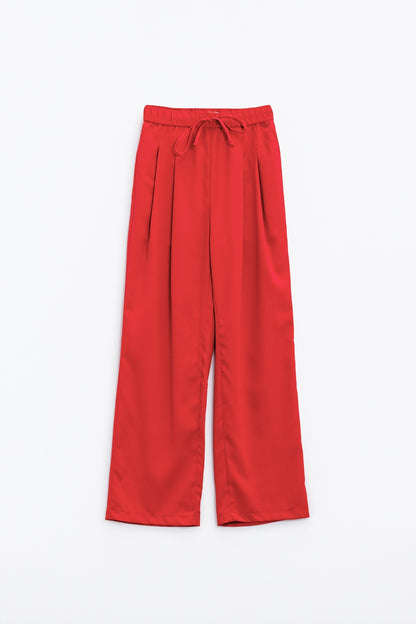 Pantalones en coral con bolsillos delanteros y cierre de cordón