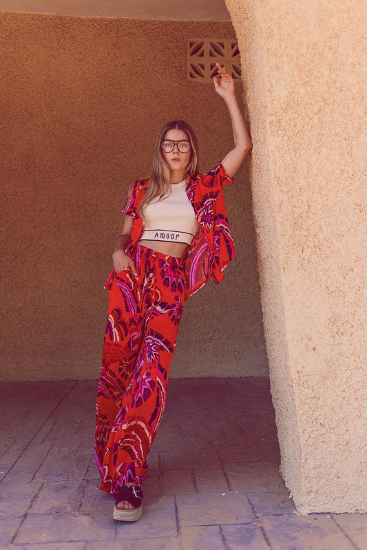 Q2 Pantalones estilo palazzo con estampado floral abstracto en naranja