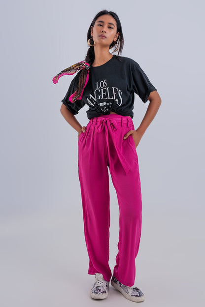 Pantalones fucsia de pernera ancha con cinturón
