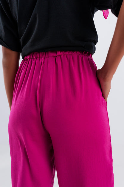 Pantalones fucsia de pernera ancha con cinturón