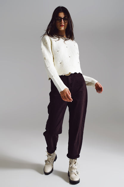 Pantalones marrones relajados con detalles de bolsillo en la cintura