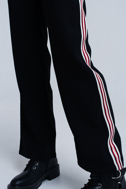 Pantalones negros con detalle de rayas