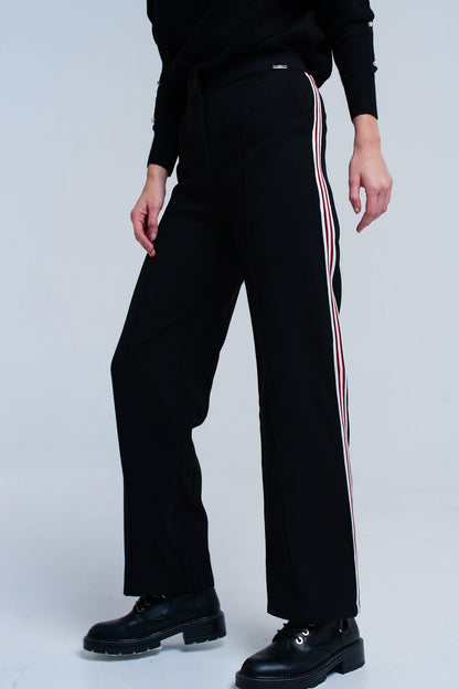 Pantalones negros con detalle de rayas
