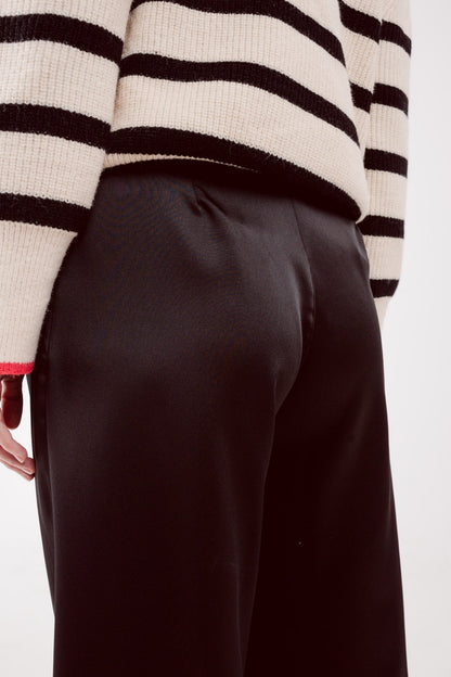 Pantalones palazzo con pinzas en negro