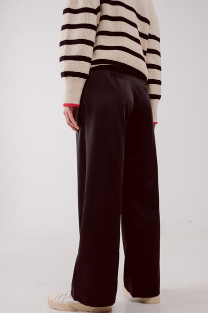 Pantalones palazzo con pinzas en negro