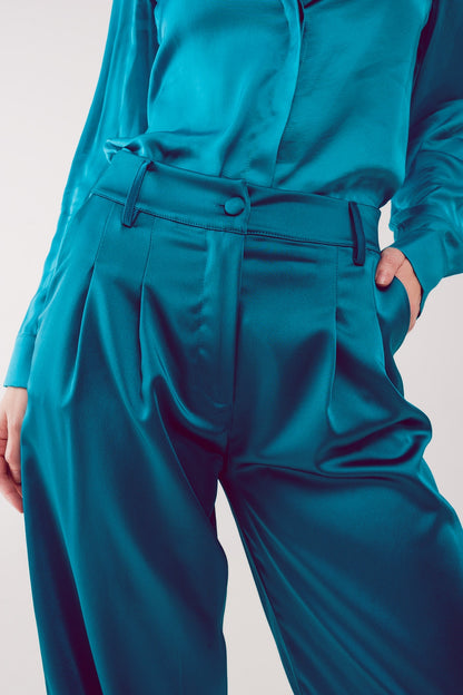 Pantalones palazzo con pinzas en turquesa