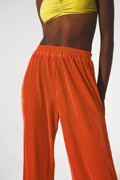 Pantalones plisados de satén naranja