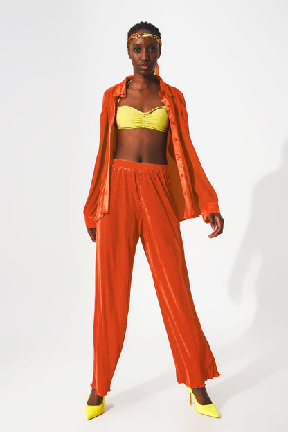 Pantalones plisados de satén naranja