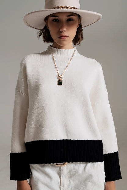 suéter blanco con puños y dobladillo negros